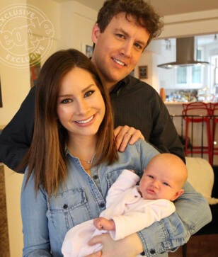 Matthew Pierce Hanson with his wife, Rebecca Jarvis, and their baby.